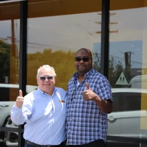 2 people in front of a fast food restaurant